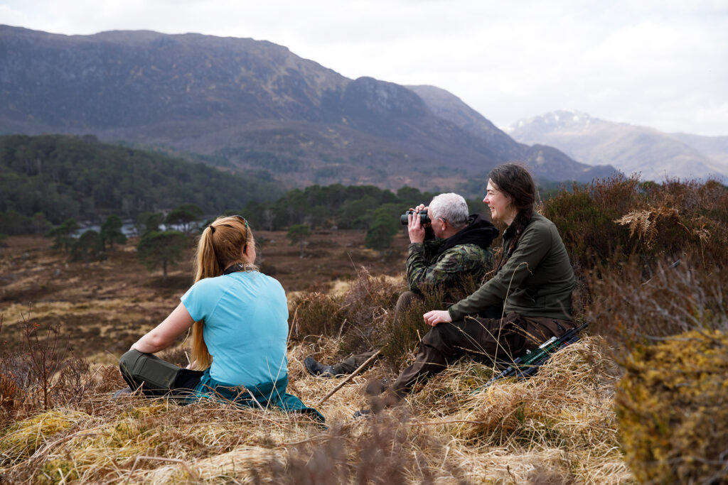 Researchers and estate stalker in the Affric Highlands in Scotland